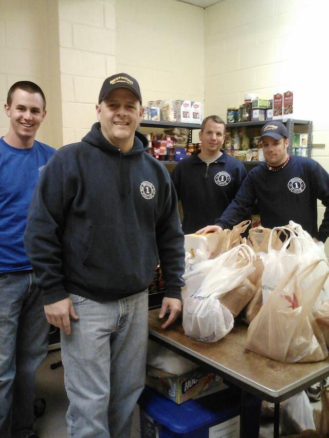 Members of the Westmont Fire Company deliver Easter Hams to the local Food Pantry. (l-r: Josh Bennett, Joe Piscopio, Jim Bresch and Bob Casey)